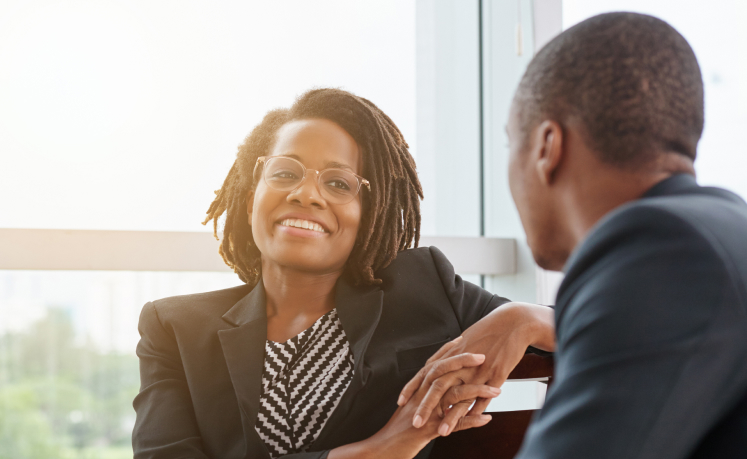Woman looking at male advisor